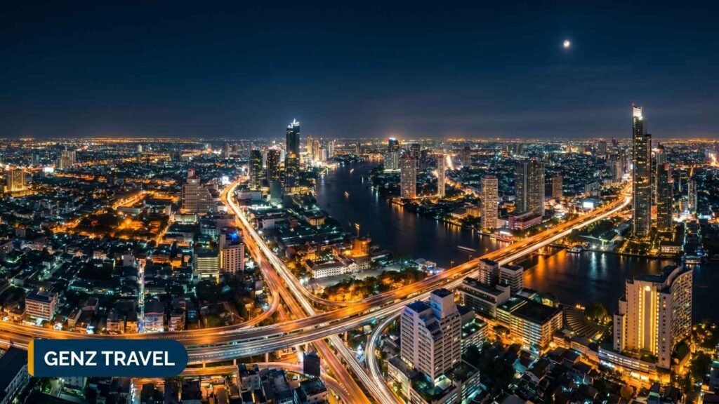 Aerial night view of Bangkok Thailand city skyline showing hotel districts along the Chao Phraya River