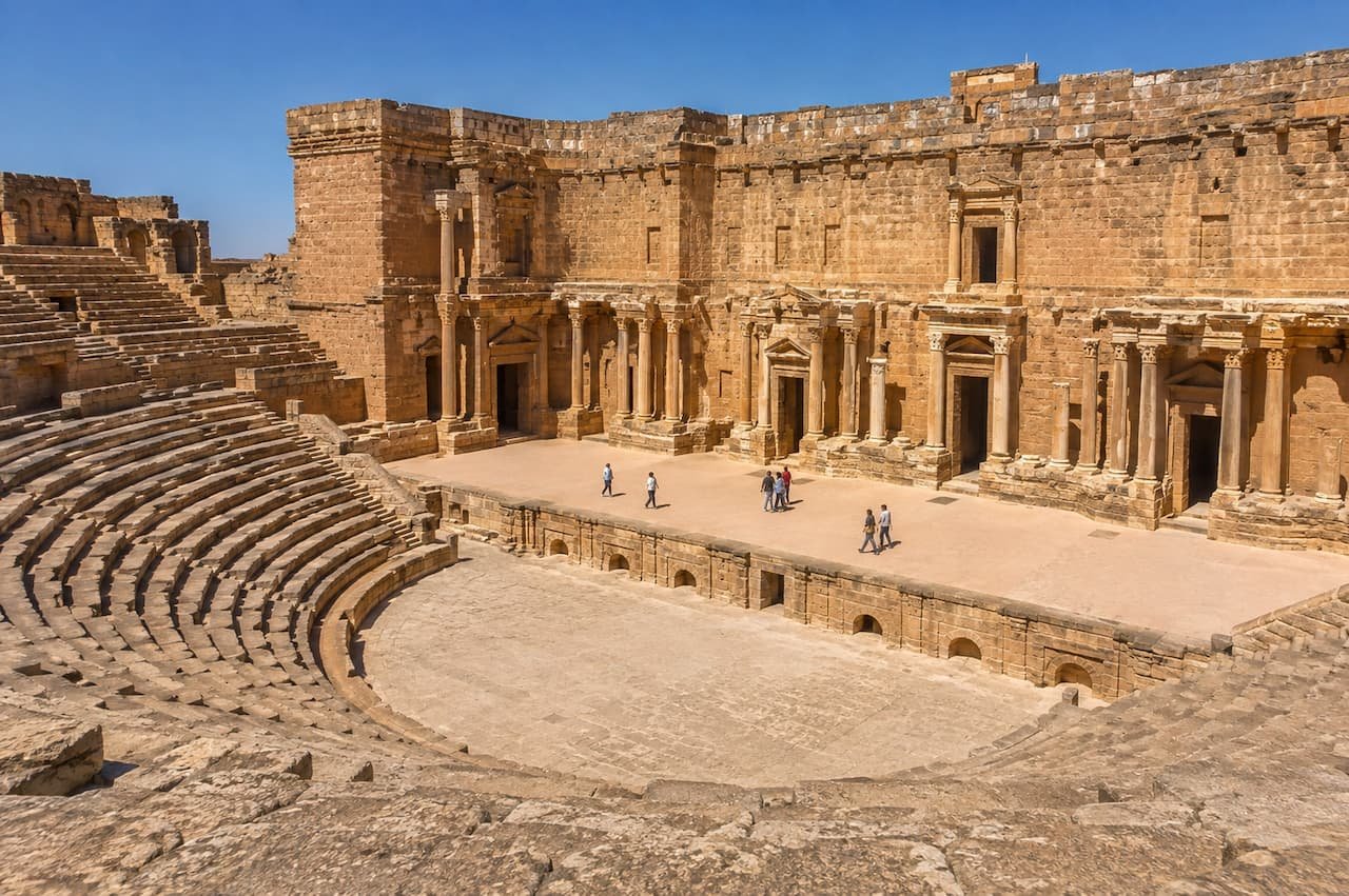 Stone seating and preserved Roman stage building inside Aspendos Theatre near Antalya.