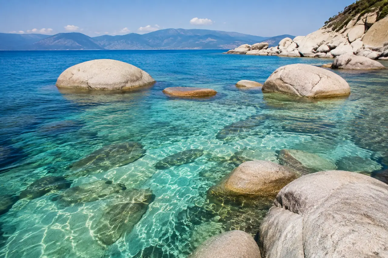 Clear turquoise water and large white rocks along Antalya’s Mediterranean coast.
