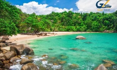 Calm and peaceful beach resort in Khao Lak with long sandy shoreline and palm trees