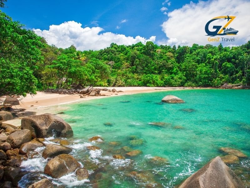 Calm and peaceful beach resort in Khao Lak with long sandy shoreline and palm trees