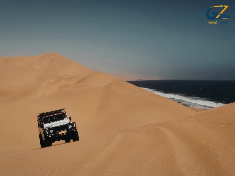 4x4 dune bashing experience in Abu Dhabi desert with golden sand dunes during sunset safari