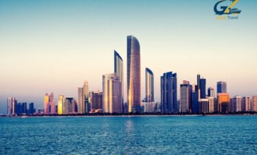 Sheikh Zayed Grand Mosque and skyline in Abu Dhabi during sunset