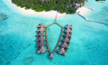 Adaaran Select Meedhupparu Maldives beach villa with white sand and turquoise lagoon