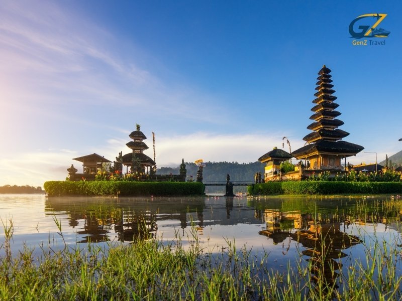 Traditional Balinese temple near tropical waterfall surrounded by jungle
