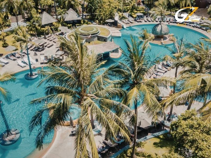 Luxury all-inclusive poolside bar in Cancun with palm trees and ocean view for UK holiday package