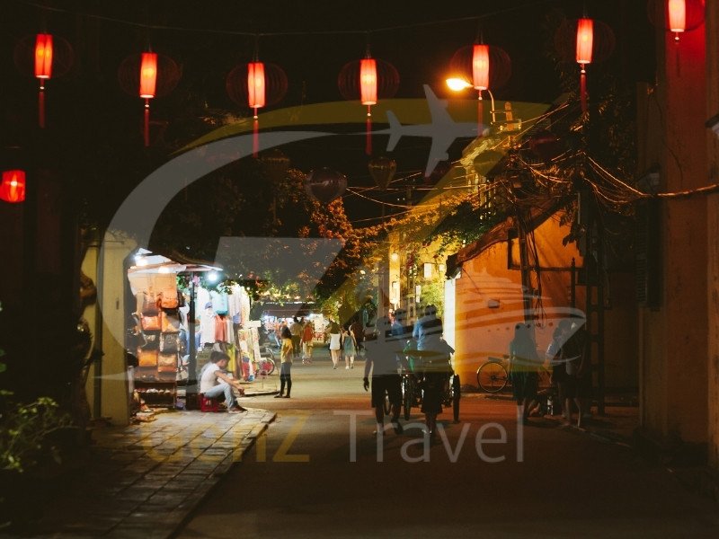 Vietnam holiday packages Hoi An lantern street at night with colorful lights and old town charm