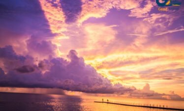 Khao Lak peaceful beach sunset with palm trees Thailand holiday destination