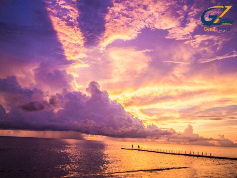 Khao Lak peaceful beach sunset with palm trees Thailand holiday destination