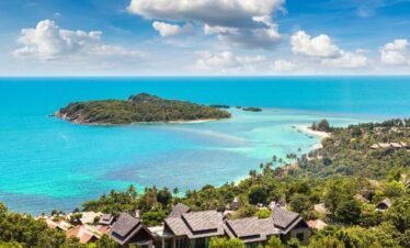 Koh Samui luxury beach resort with palm trees and turquoise sea for Thailand island holiday