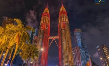 Petronas Twin Towers in Kuala Lumpur glowing at night with city skyline