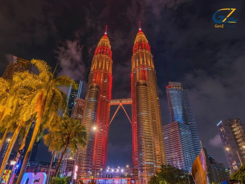 Petronas Twin Towers in Kuala Lumpur glowing at night with city skyline