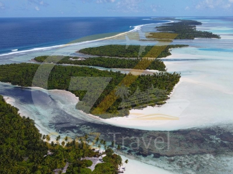 Aerial drone view of Maldives atoll islands with white sand beaches and clear blue ocean