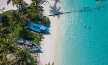 Aerial view of Siyam World Maldives island surrounded by turquoise ocean and white sand
