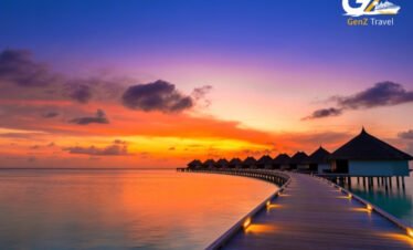 Maldives all inclusive resort aerial view with turquoise lagoon and white sand beach