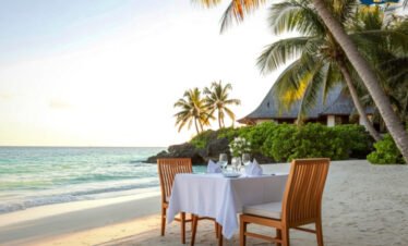 Romantic sunset dinner setup on Maldives beach for honeymoon couples