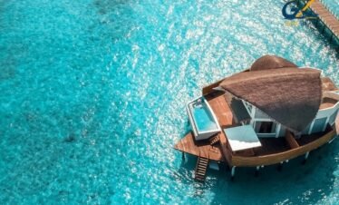 Luxury overwater villa with private pool in Maldives lagoon