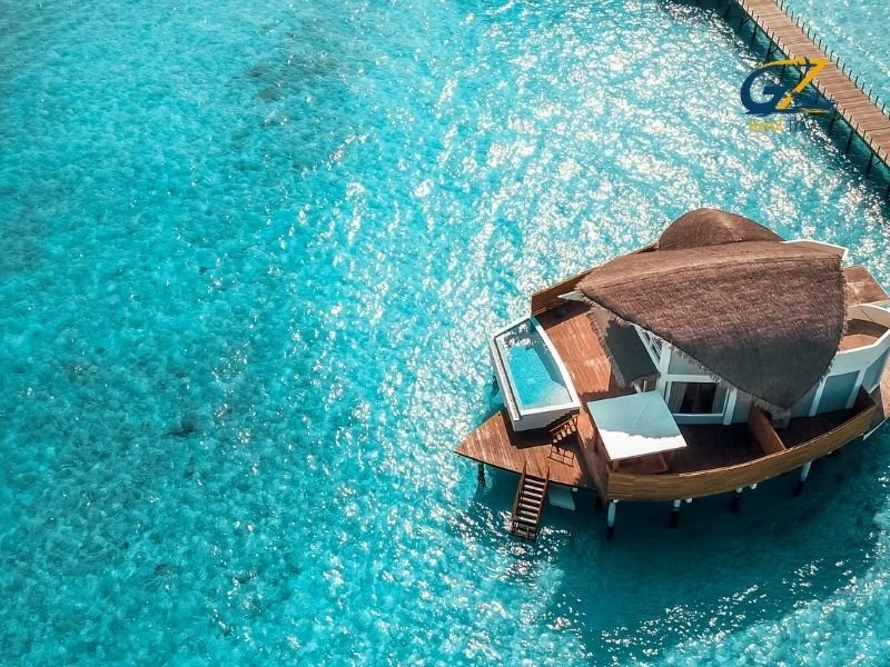 Luxury overwater villa with private pool in Maldives lagoon