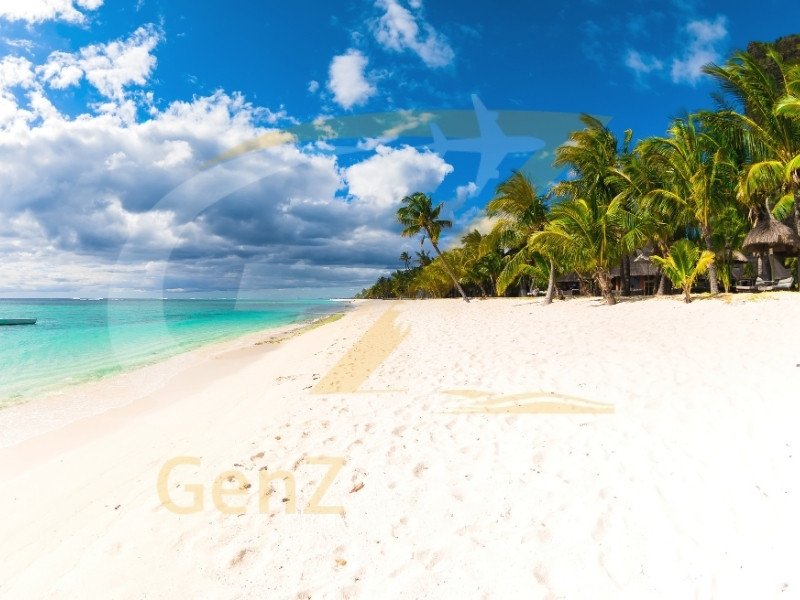 Mauritius white sand beach with palm trees and crystal clear Indian Ocean lagoon