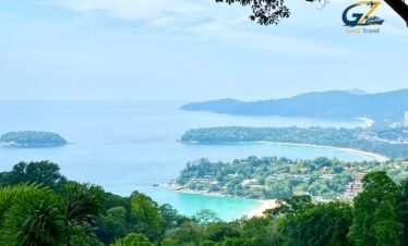 Scenic view of Kata Beach in Phuket with turquoise water, palm trees and luxury tropical resort atmosphere