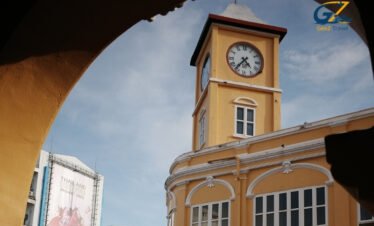 Colorful Phuket Old Town street with night market lights, colonial buildings and vibrant Thai culture atmosphere