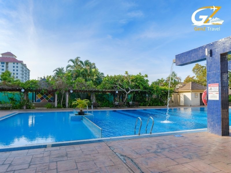 Ramada Resort Lara Antalya pool area with sun loungers and all inclusive facilities