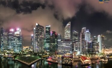 Stunning night view of Marina Bay skyline in Singapore with illuminated skyscrapers and waterfront reflections