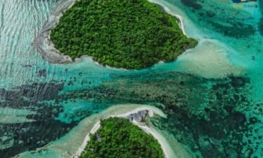 Aerial view of Siyam World Maldives island with white sand beaches and turquoise ocean