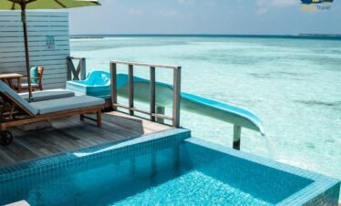 Siyam World Maldives water villa with private pool and slide into turquoise lagoon