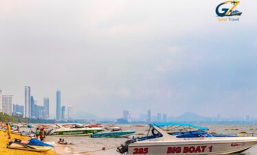 Speedboat traveling across turquoise waters from Phuket to Koh Yao Yai surrounded by limestone islands