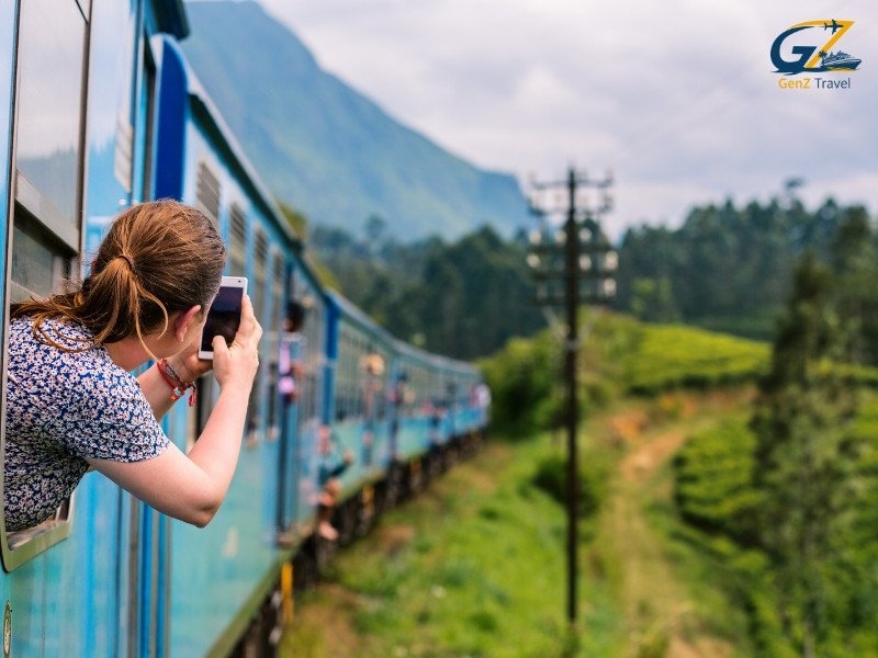 Scenic train journey through lush tea plantations in Nuwara Eliya with misty hills and greenery