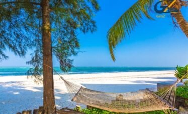 Zanzibar beach resort with palm trees, turquoise ocean and luxury all inclusive hotel setting
