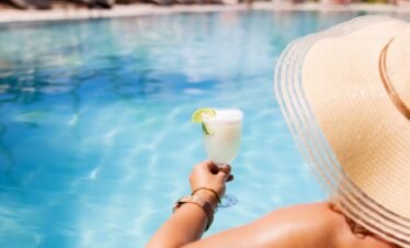 poolside all-inclusive dining at Canareef Resort Maldives with tropical buffet and ocean backdrop.