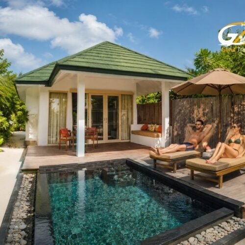 UK couple relaxing by the private pool at Siyam World Maldives Sunset Pool Beach Villa