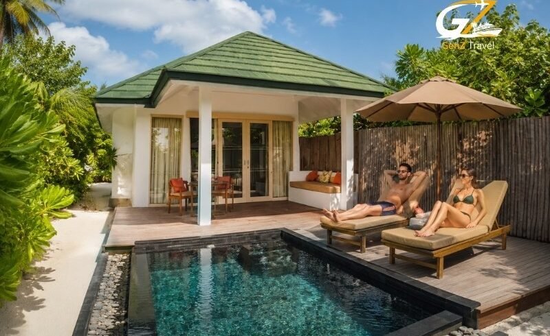 UK couple relaxing by the private pool at Siyam World Maldives Sunset Pool Beach Villa
