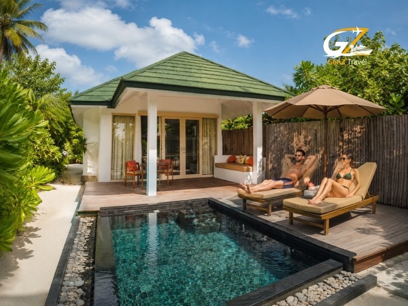 UK couple relaxing by the private pool at Siyam World Maldives Sunset Pool Beach Villa