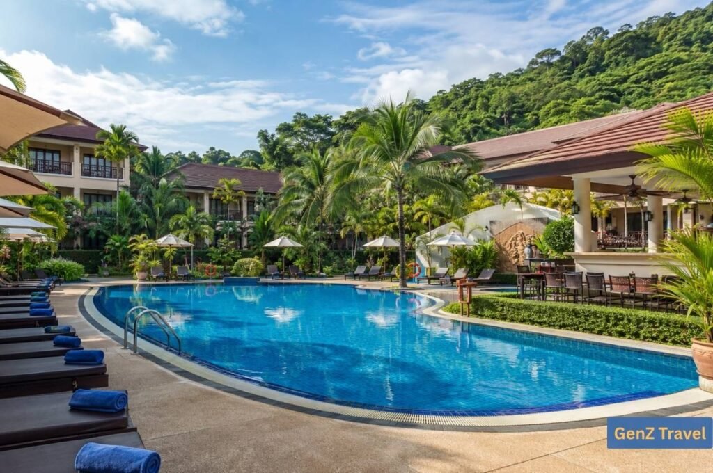 Tropical swimming pool and gardens at Naina Resort and Spa in Patong