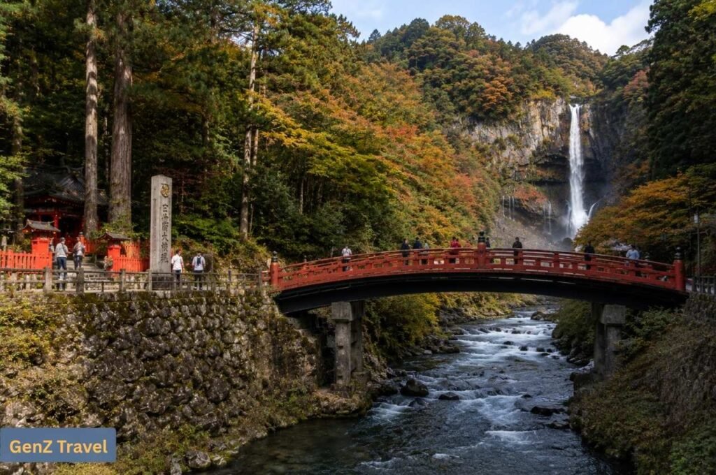 Nikko: Red Shinkyo Bridge, autumn forest and Kegon Falls in Nikko.