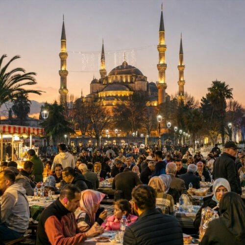 Blue Mosque Istanbul at sunset with visitors enjoying the historic Sultanahmet area