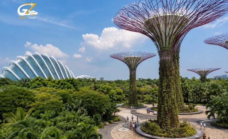 Supertree Grove and glass conservatories at Gardens by the Bay in Singapore on a bright sunny day