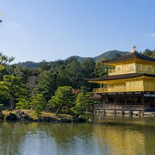Kinkaku-ji Golden Pavilion in Kyoto reflected in a peaceful pond surrounded by Japanese gardens