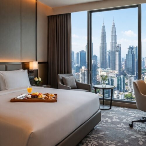 Modern hotel room in Kuala Lumpur with panoramic views of Petronas Twin Towers skyline