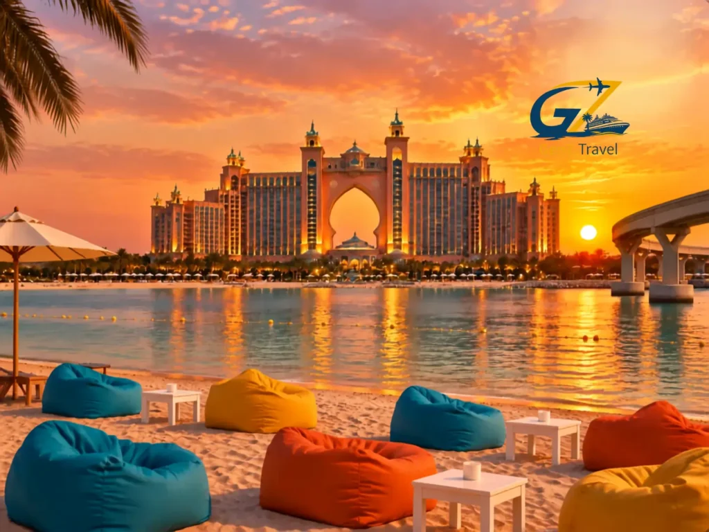 Atlantis The Palm Dubai luxury resort overlooking Jumeirah beach with sunset views, golden sky and waterfront seating area in Dubai, UAE
