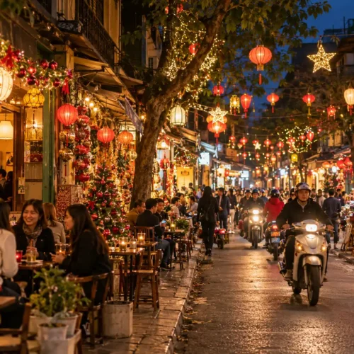 Hanoi Old Quarter decorated with Christmas lights and lanterns with busy cafés, pedestrians and scooters during the festive season