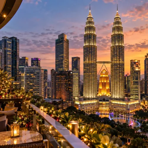 Petronas Twin Towers in Kuala Lumpur illuminated at sunset with festive Christmas decorations during Malaysia New Year holidays.