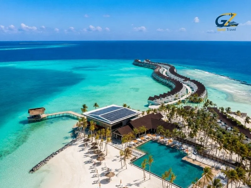 Oblu Xperience Ailafushi resort with turquoise lagoon, overwater villas, white-sand beach and beachfront swimming pool in the Maldives.